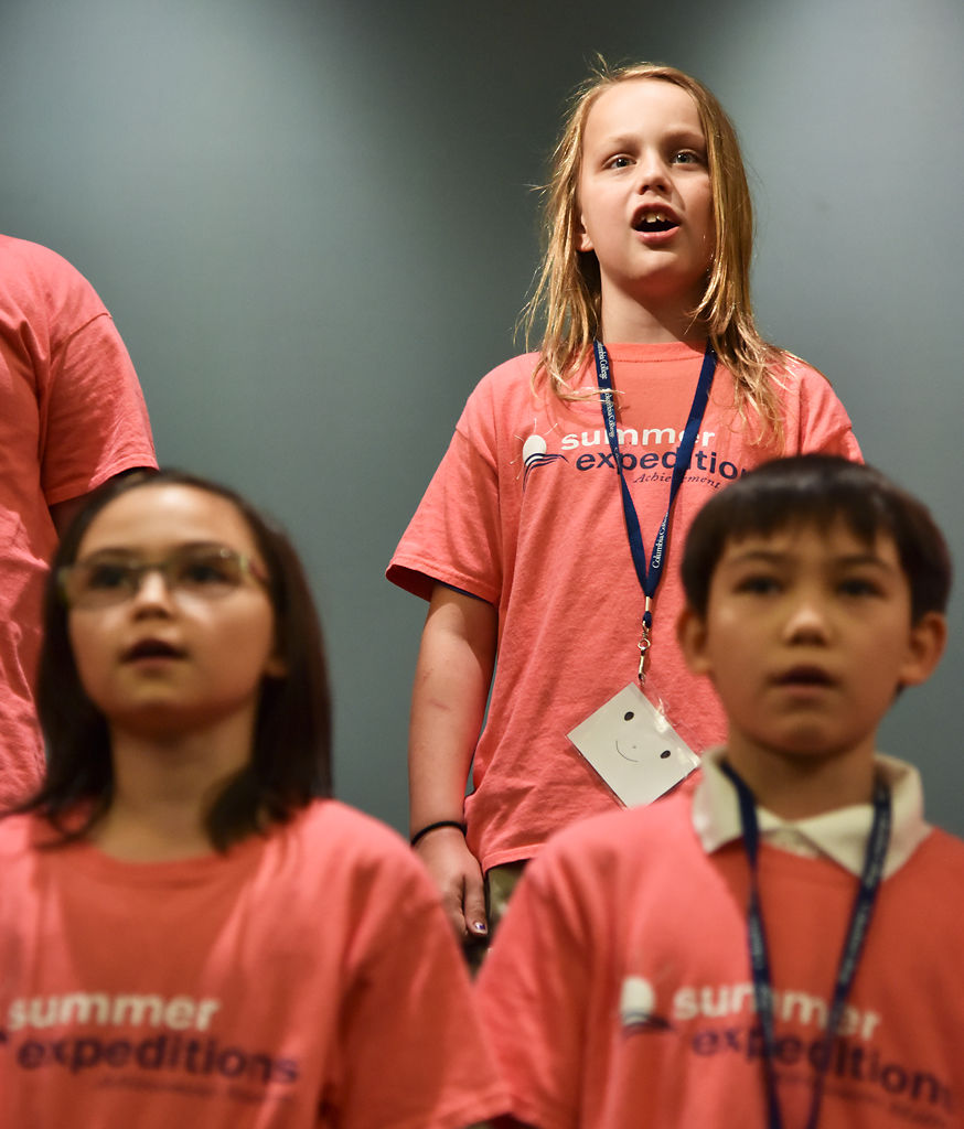 Aiden Gilmore sings along with fellow fifth graders Liv Dungan and Kai Dungan